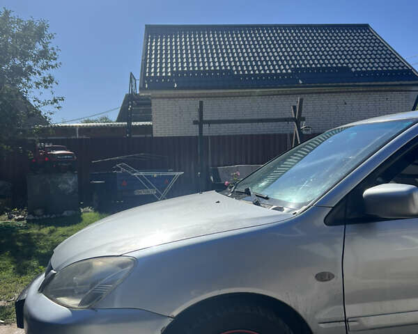 Серый Мицубиси Лансер, объемом двигателя 1.6 л и пробегом 248 тыс. км за 3000 $, фото 5 на Automoto.ua