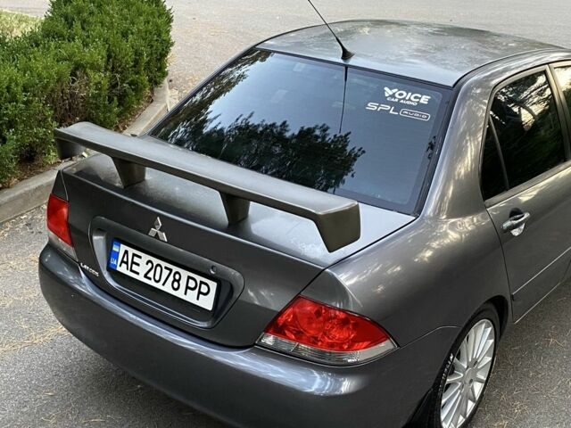 Серый Мицубиси Лансер, объемом двигателя 1.6 л и пробегом 250 тыс. км за 3999 $, фото 5 на Automoto.ua