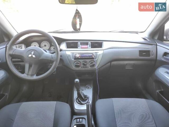 Серый Мицубиси Лансер, объемом двигателя 1.6 л и пробегом 187 тыс. км за 4500 $, фото 4 на Automoto.ua