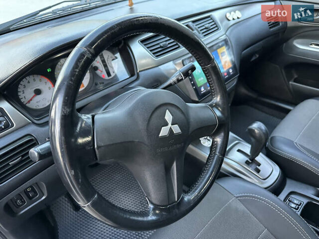 Сірий Міцубісі Lancer, об'ємом двигуна 1.6 л та пробігом 189 тис. км за 6200 $, фото 16 на Automoto.ua