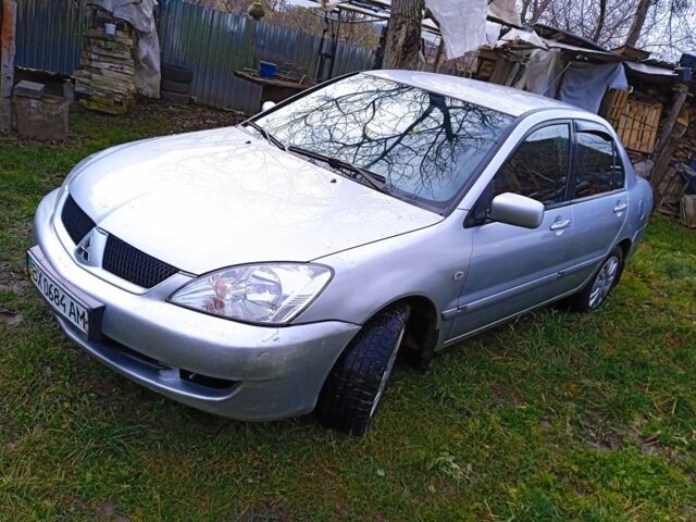 Сірий Міцубісі Lancer, об'ємом двигуна 1 л та пробігом 400 тис. км за 2850 $, фото 1 на Automoto.ua