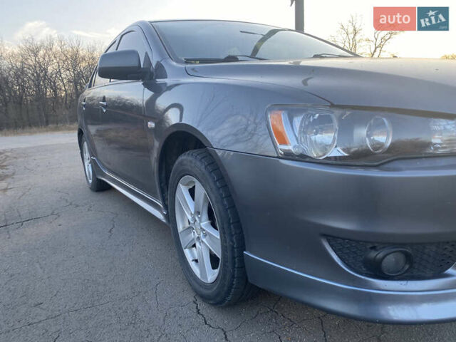 Сірий Міцубісі Lancer, об'ємом двигуна 2 л та пробігом 205 тис. км за 7000 $, фото 7 на Automoto.ua