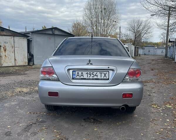 Сірий Міцубісі Lancer, об'ємом двигуна 1.58 л та пробігом 305 тис. км за 3300 $, фото 3 на Automoto.ua