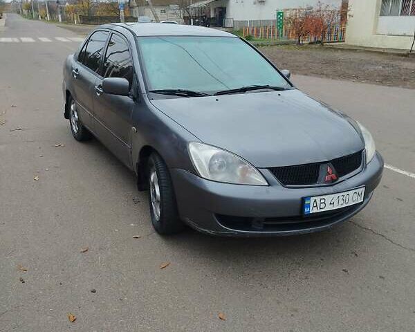 Серый Мицубиси Лансер, объемом двигателя 1.6 л и пробегом 250 тыс. км за 3800 $, фото 2 на Automoto.ua