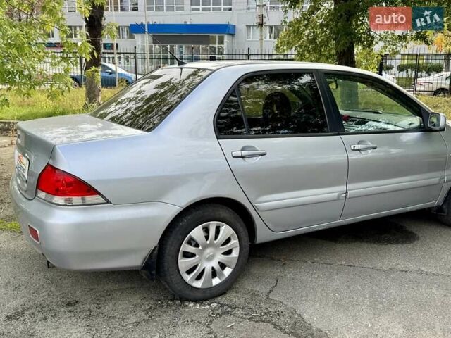 Сірий Міцубісі Lancer, об'ємом двигуна 1.58 л та пробігом 138 тис. км за 4990 $, фото 12 на Automoto.ua