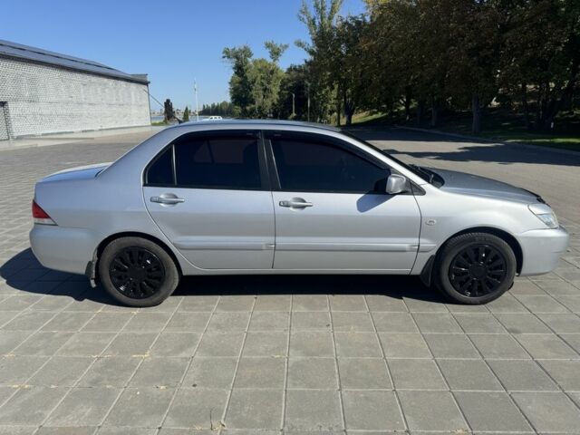 Серый Мицубиси Лансер, объемом двигателя 1.6 л и пробегом 265 тыс. км за 4100 $, фото 2 на Automoto.ua