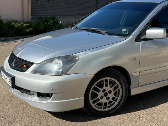 Серый Мицубиси Лансер, объемом двигателя 2 л и пробегом 231 тыс. км за 4500 $, фото 6 на Automoto.ua