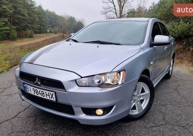Серый Мицубиси Лансер, объемом двигателя 2 л и пробегом 213 тыс. км за 6550 $, фото 1 на Automoto.ua