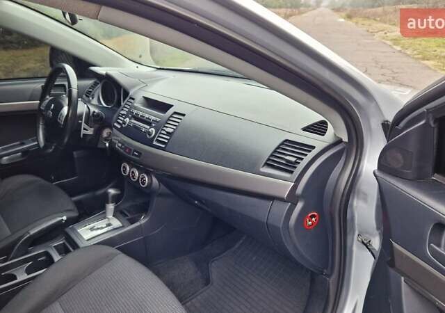 Серый Мицубиси Лансер, объемом двигателя 2 л и пробегом 213 тыс. км за 6550 $, фото 17 на Automoto.ua