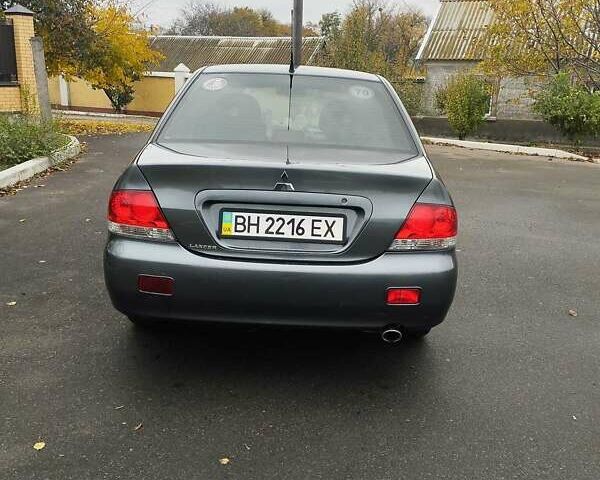 Серый Мицубиси Лансер, объемом двигателя 1.6 л и пробегом 181 тыс. км за 4500 $, фото 8 на Automoto.ua