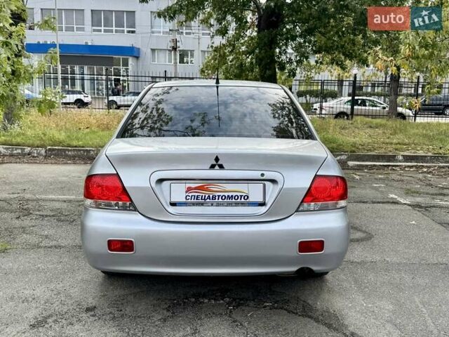 Сірий Міцубісі Lancer, об'ємом двигуна 1.58 л та пробігом 138 тис. км за 4990 $, фото 14 на Automoto.ua