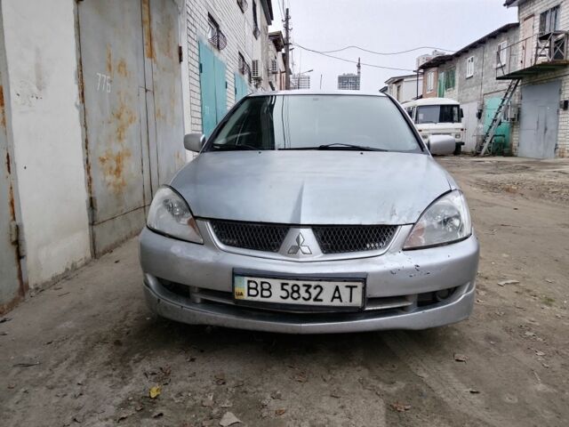 Серый Мицубиси Лансер, объемом двигателя 2 л и пробегом 495 тыс. км за 2800 $, фото 3 на Automoto.ua