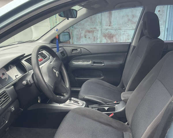 Серый Мицубиси Лансер, объемом двигателя 1.58 л и пробегом 205 тыс. км за 4750 $, фото 9 на Automoto.ua