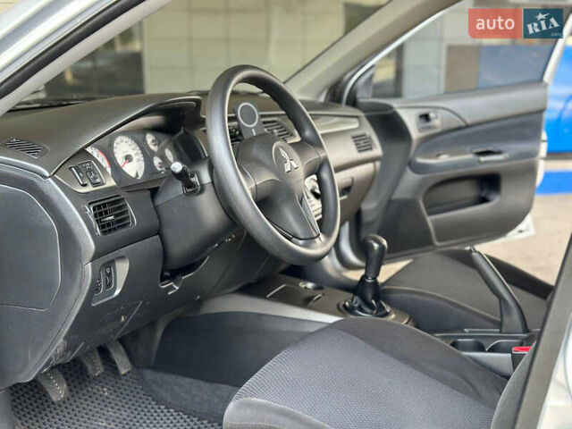 Сірий Міцубісі Lancer, об'ємом двигуна 1.58 л та пробігом 181 тис. км за 5699 $, фото 10 на Automoto.ua
