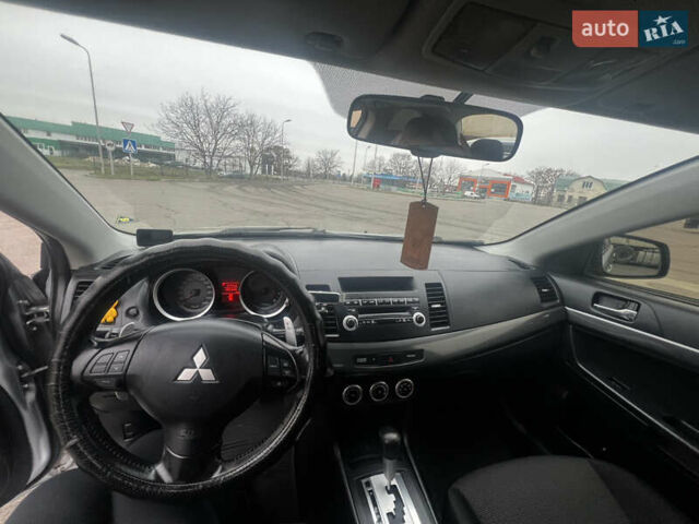 Серый Мицубиси Лансер, объемом двигателя 2 л и пробегом 286 тыс. км за 5800 $, фото 11 на Automoto.ua