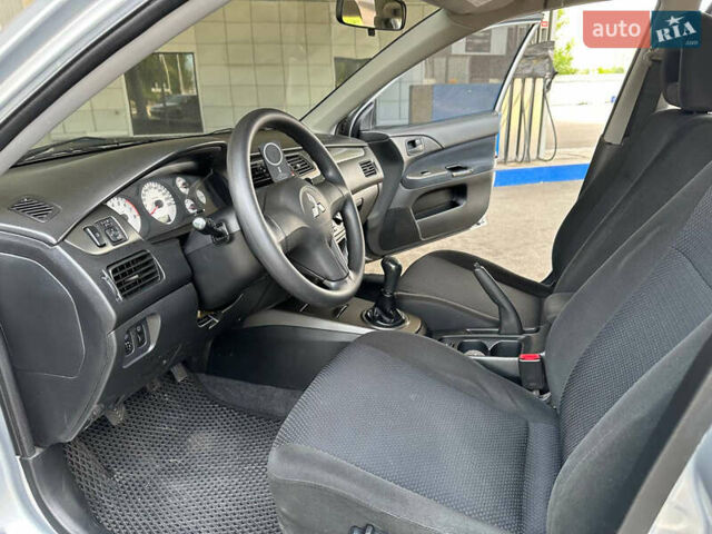 Сірий Міцубісі Lancer, об'ємом двигуна 1.58 л та пробігом 181 тис. км за 5699 $, фото 12 на Automoto.ua