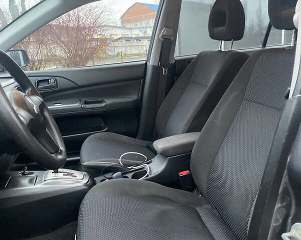 Серый Мицубиси Лансер, объемом двигателя 1.6 л и пробегом 346 тыс. км за 4299 $, фото 7 на Automoto.ua