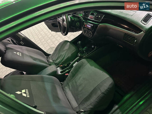 Серый Мицубиси Лансер, объемом двигателя 1.6 л и пробегом 112 тыс. км за 2800 $, фото 18 на Automoto.ua