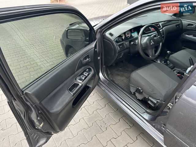 Сірий Міцубісі Lancer, об'ємом двигуна 1.6 л та пробігом 115 тис. км за 2800 $, фото 10 на Automoto.ua