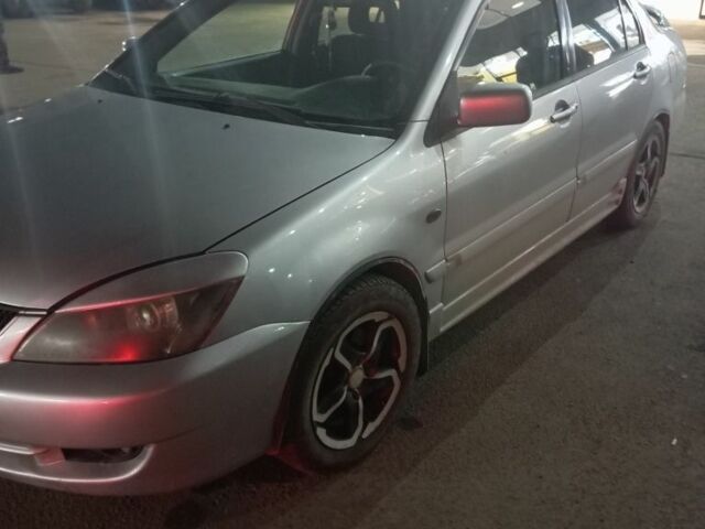 Серый Мицубиси Лансер, объемом двигателя 1.6 л и пробегом 308 тыс. км за 3800 $, фото 2 на Automoto.ua