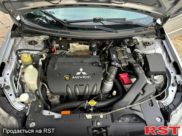 Серый Мицубиси Лансер, объемом двигателя 2 л и пробегом 250 тыс. км за 6000 $, фото 4 на Automoto.ua