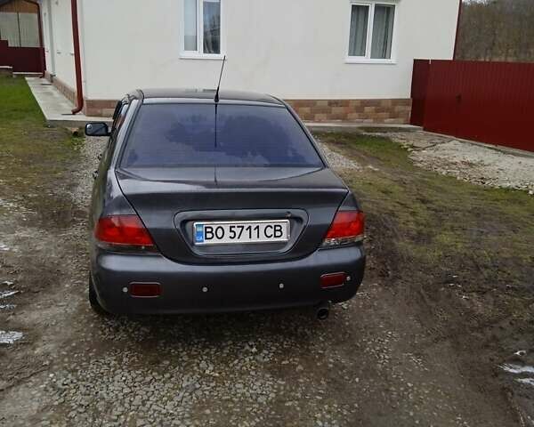 Сірий Міцубісі Lancer, об'ємом двигуна 1.6 л та пробігом 337 тис. км за 4600 $, фото 13 на Automoto.ua