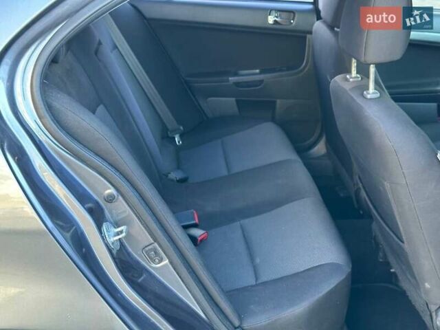 Сірий Міцубісі Lancer, об'ємом двигуна 2 л та пробігом 242 тис. км за 6300 $, фото 3 на Automoto.ua