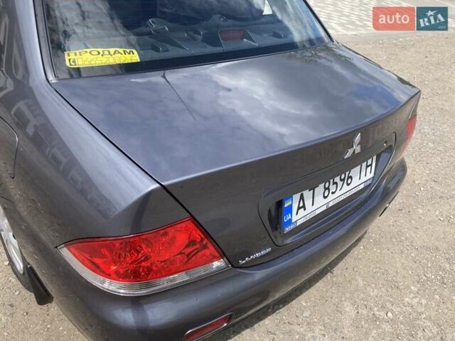 Сірий Міцубісі Lancer, об'ємом двигуна 1.59 л та пробігом 44 тис. км за 6200 $, фото 10 на Automoto.ua