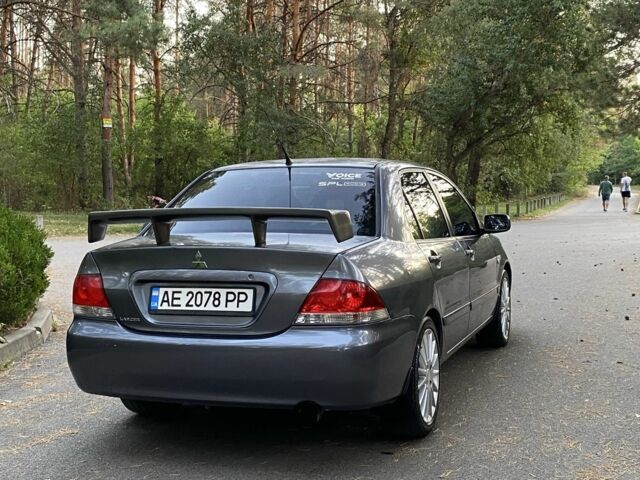 Серый Мицубиси Лансер, объемом двигателя 1.6 л и пробегом 250 тыс. км за 3999 $, фото 2 на Automoto.ua