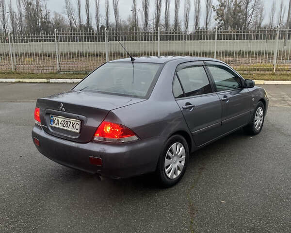 Серый Мицубиси Лансер, объемом двигателя 1.6 л и пробегом 346 тыс. км за 4299 $, фото 2 на Automoto.ua