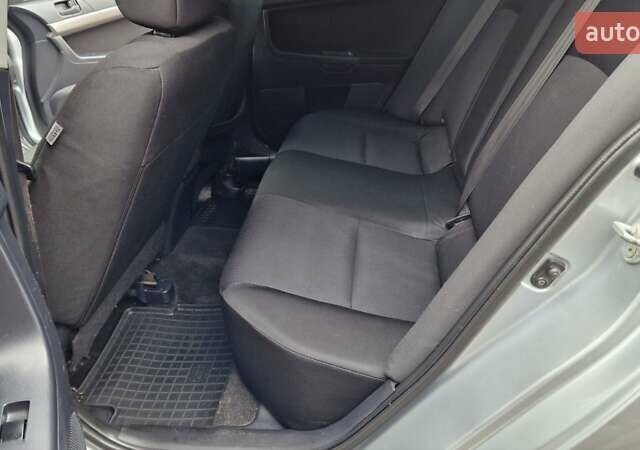 Серый Мицубиси Лансер, объемом двигателя 2 л и пробегом 213 тыс. км за 6550 $, фото 15 на Automoto.ua