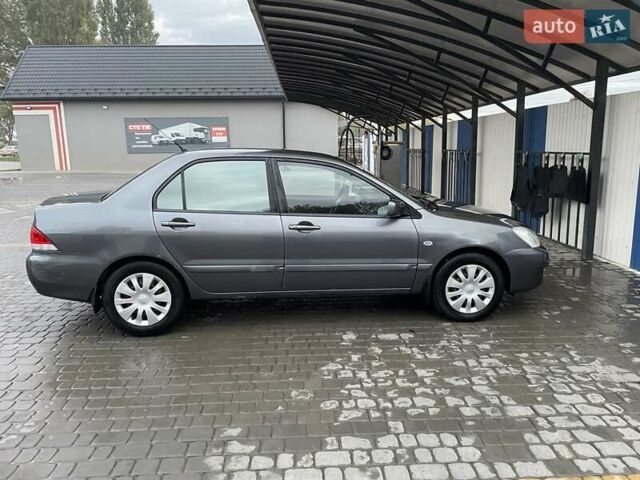 Сірий Міцубісі Lancer, об'ємом двигуна 1.6 л та пробігом 330 тис. км за 3500 $, фото 18 на Automoto.ua
