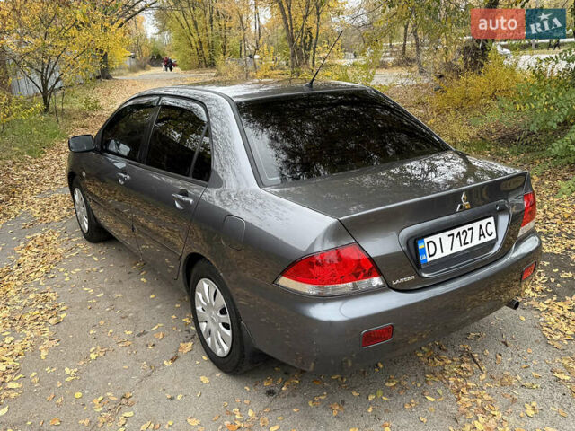 Сірий Міцубісі Lancer, об'ємом двигуна 1.58 л та пробігом 247 тис. км за 4900 $, фото 13 на Automoto.ua