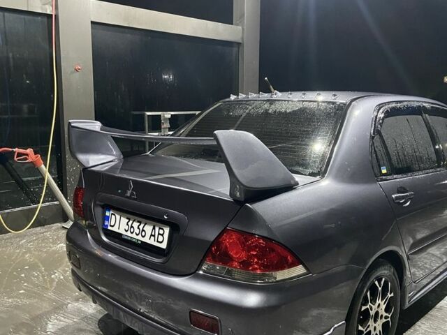 Серый Мицубиси Лансер, объемом двигателя 1.6 л и пробегом 280 тыс. км за 4000 $, фото 1 на Automoto.ua