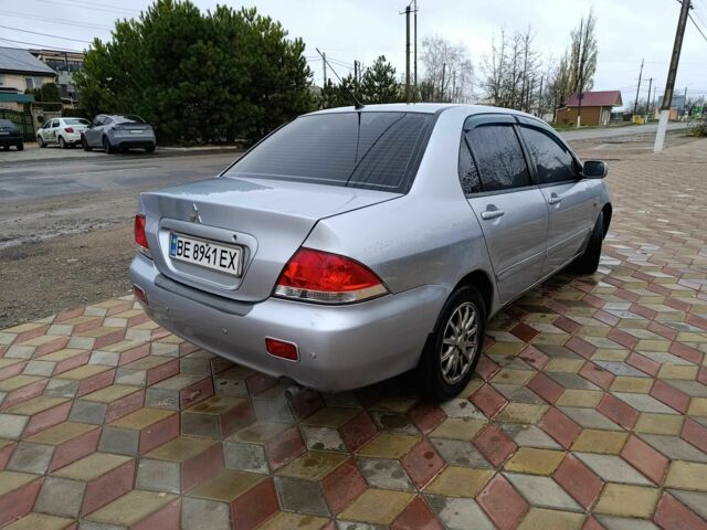 Серый Мицубиси Лансер, объемом двигателя 1.6 л и пробегом 238 тыс. км за 2900 $, фото 2 на Automoto.ua