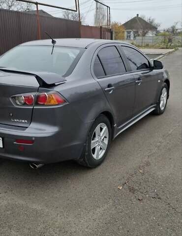 Серый Мицубиси Лансер, объемом двигателя 2 л и пробегом 189 тыс. км за 6800 $, фото 4 на Automoto.ua