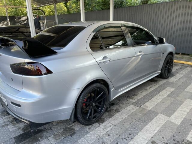 Серый Мицубиси Лансер, объемом двигателя 2 л и пробегом 244 тыс. км за 6500 $, фото 3 на Automoto.ua