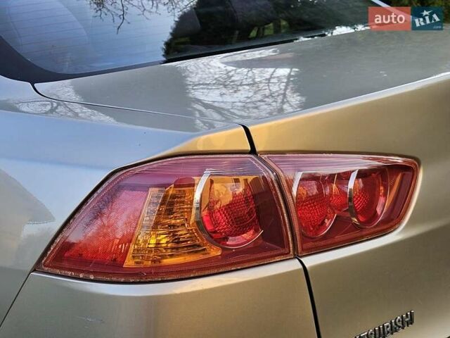 Серый Мицубиси Лансер, объемом двигателя 2 л и пробегом 282 тыс. км за 5450 $, фото 35 на Automoto.ua