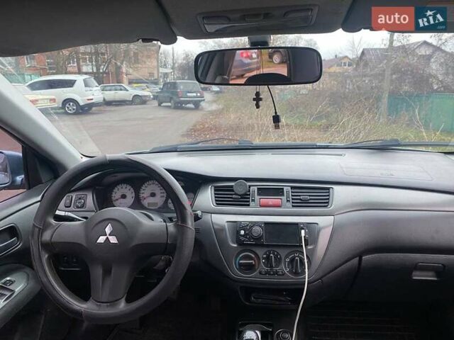 Серый Мицубиси Лансер, объемом двигателя 1.6 л и пробегом 218 тыс. км за 5000 $, фото 2 на Automoto.ua