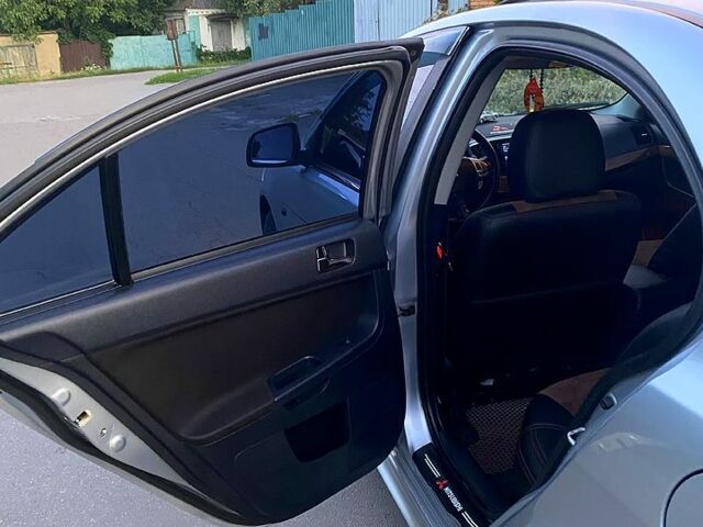 Серый Мицубиси Лансер, объемом двигателя 2 л и пробегом 220 тыс. км за 6500 $, фото 11 на Automoto.ua