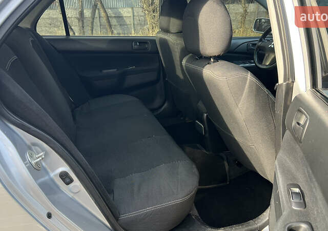 Серый Мицубиси Лансер, объемом двигателя 1.58 л и пробегом 290 тыс. км за 3750 $, фото 8 на Automoto.ua