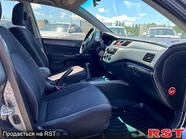 Сірий Міцубісі Lancer, об'ємом двигуна 1.6 л та пробігом 130 тис. км за 3999 $, фото 9 на Automoto.ua