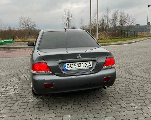 Сірий Міцубісі Lancer, об'ємом двигуна 1.6 л та пробігом 253 тис. км за 3100 $, фото 4 на Automoto.ua
