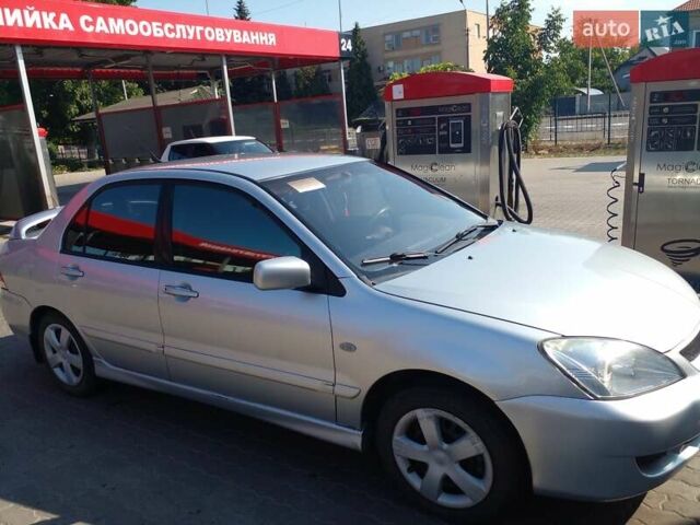 Серый Мицубиси Лансер, объемом двигателя 1.6 л и пробегом 210 тыс. км за 3500 $, фото 5 на Automoto.ua