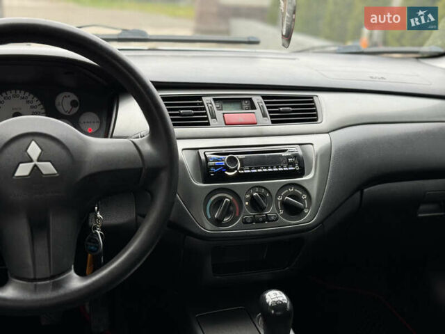 Сірий Міцубісі Lancer, об'ємом двигуна 1.6 л та пробігом 281 тис. км за 3999 $, фото 22 на Automoto.ua