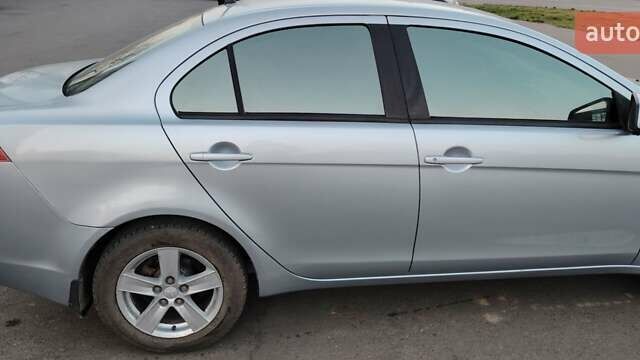 Серый Мицубиси Лансер, объемом двигателя 1.5 л и пробегом 201 тыс. км за 5600 $, фото 1 на Automoto.ua