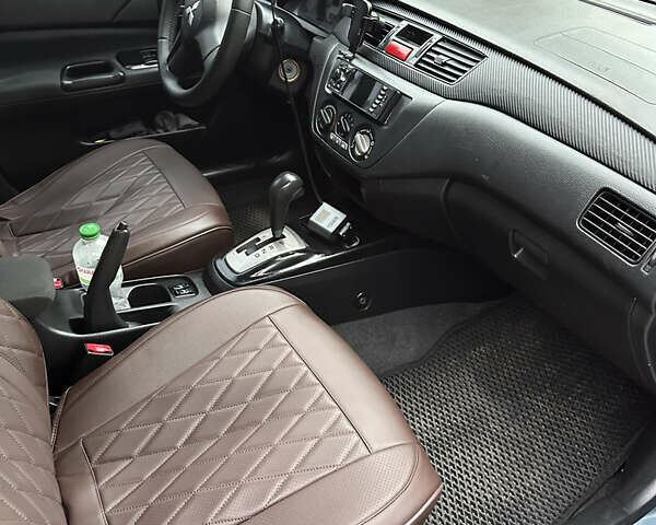 Серый Мицубиси Лансер, объемом двигателя 1.6 л и пробегом 238 тыс. км за 4400 $, фото 16 на Automoto.ua