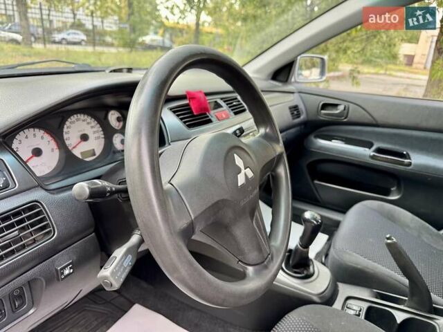 Сірий Міцубісі Lancer, об'ємом двигуна 1.58 л та пробігом 138 тис. км за 4990 $, фото 25 на Automoto.ua