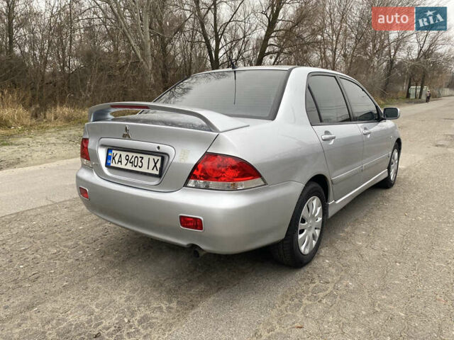 Серый Мицубиси Лансер, объемом двигателя 1.58 л и пробегом 240 тыс. км за 5500 $, фото 2 на Automoto.ua