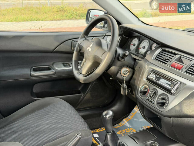 Сірий Міцубісі Lancer, об'ємом двигуна 1.3 л та пробігом 160 тис. км за 4999 $, фото 69 на Automoto.ua